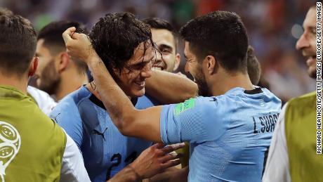 Cavani and Suarez celebrate Uruguay&#39;s winner.