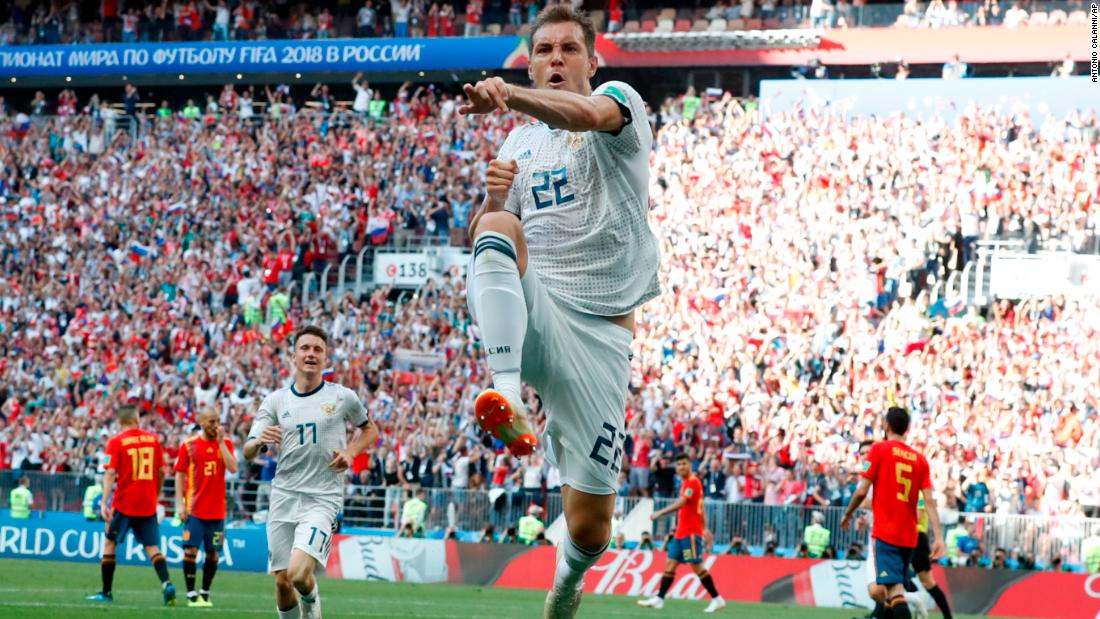 Russia&#39;s Artem Dzyuba celebrates after scoring against Spain in the first half.
