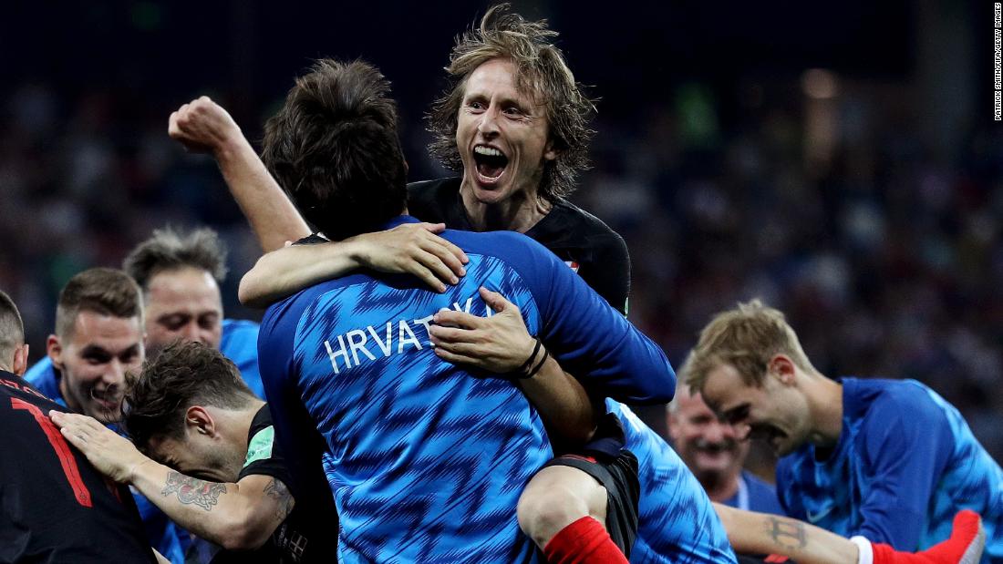Croatia&#39;s Luka Modric celebrates with teammates after their victory over Denmark on July 1. Croatia won on penalties after the match ended 1-1. 