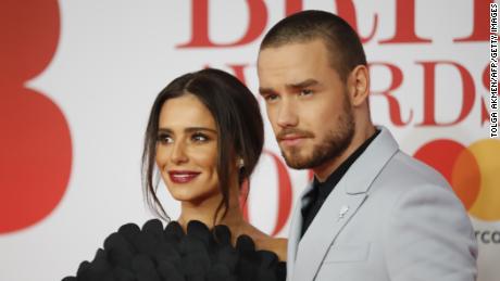 British singer-songwriter Liam Payne and partner Cheryl pose on the red carpet on arrival for the BRIT Awards 2018 in London on February 21, 2018.