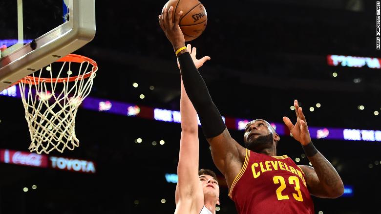 LOS ANGELES, CA - MARCH 19:  LeBron James #23 of the Cleveland Cavaliers attempts a layup over Ivica Zubac #40 of the Los Angeles Lakers at Staples Center on March 19, 2017 in Los Angeles, California.  NOTE TO USER: User expressly acknowledges and agrees that, by downloading and or using this photograph, User is consenting to the terms and conditions of the Getty Images License Agreement.  (Photo by Harry How/Getty Images)