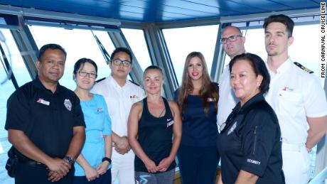 Crew members on Carnival Glory who played a role in the rescue at sea on Sunday of a Norwegian Cruise Line crew member. From left to right: Securitay Guard Ramon Morales; Assistant Stateroom Steward Ni Puti Kharisma Dew Wiryanari; Assitance Chief Security Rishu Thapa; Playlist Dancer Karleigh Wright; Assistant Shore Excursion Manager Maja Krstic; Captain Pero Grubješić; Safety Officer Cesare Mattera and Security Guard Irma Caldino Mariscotes.