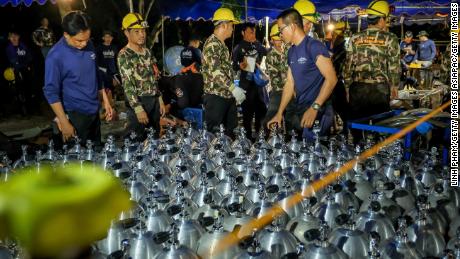 Scuba tanks are delivered to the site to aid rescue efforts. 