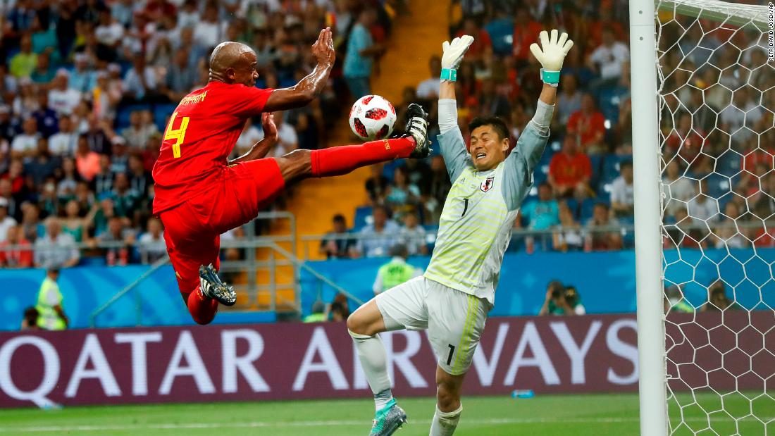 Belgium defender Vincent Kompany nearly scores in the first half.