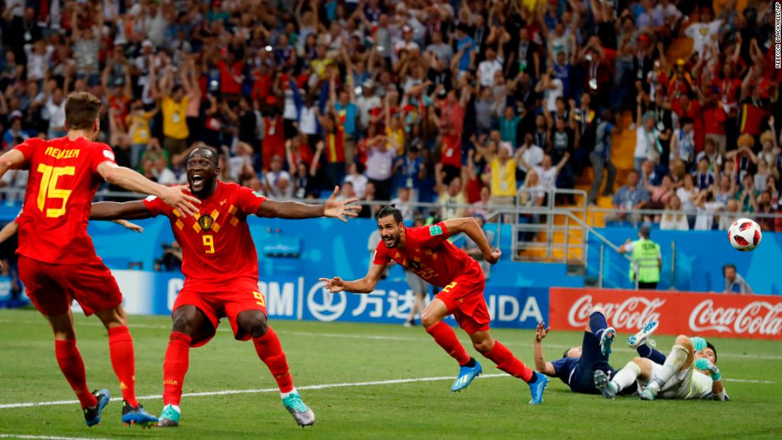 Belgium players celebrate after Nacer Chadli, third from right, scored with just seconds remaining to win the round-of-16 match against Japan on July 2.
