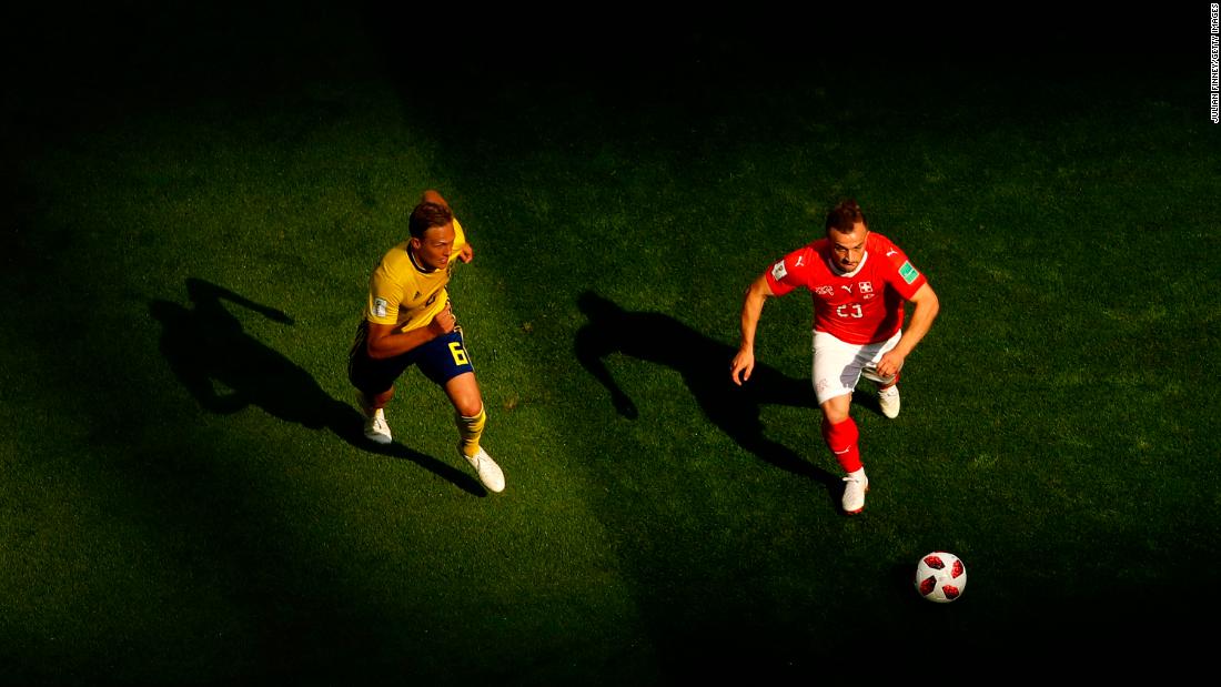 Switzerland&#39;s Xherdan Shaqiri is challenged by Ludwig Augustinsson.