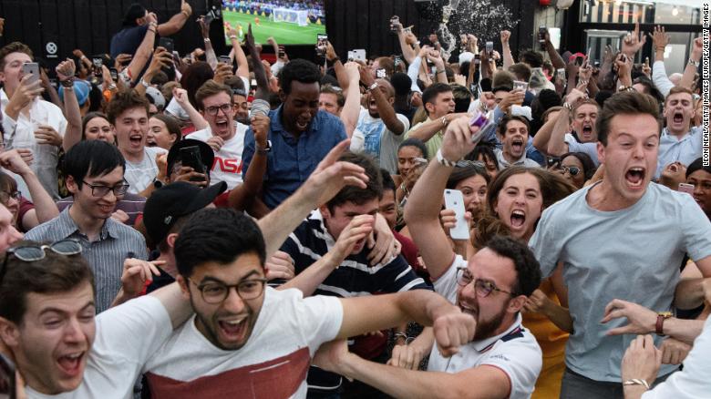 Pints are thrown, limbs go flying and screams are deafening as fans in London, England celebrate their team reaching the last eight of the World Cup. 