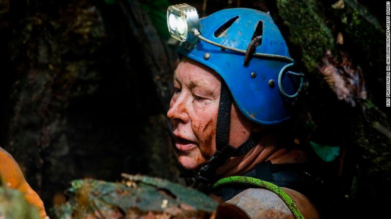 British cave-diver Robert Charles Harper explores an opening in the mountain in the rescue operation.