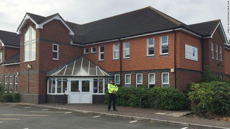 A police officer stands outside the Amesbury Baptist Church in Wiltshire.