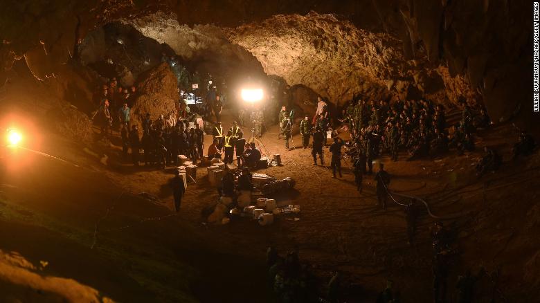 Thai soldiers relay electric cable deep in the Tham Luang Nang Non cave system.