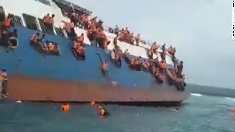 People Cling To Ferry As It Capsizes