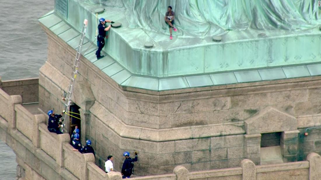 statue of liberty girl arrested