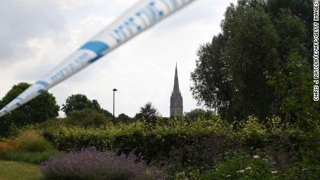 The spire of Salisbury Cathedral is seen behind police tape cordoning off Queen Elizabeth Gardens in Salisbury on Thursday.