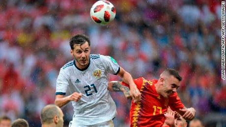 Russia's midfielder Aleksandr Erokhin (L) vies with Spain's forward Iago Aspas during the Russia 2018 World Cup round of 16 football match between Spain and Russia at the Luzhniki Stadium in Moscow on July 1, 2018. (Photo by Juan Mabromata / AFP) / RESTRICTED TO EDITORIAL USE - NO MOBILE PUSH ALERTS/DOWNLOADS        (Photo credit should read JUAN MABROMATA/AFP/Getty Images)