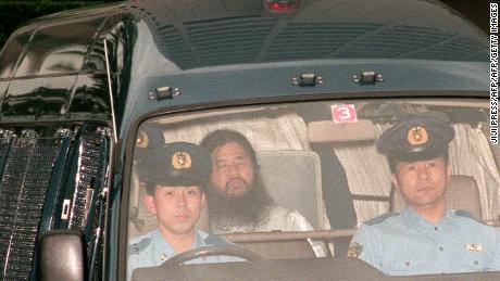 In this picture taken on July 19, 1995, Shoko Asahara (C), head of the doomsday cult Aum Shinrikyo, is transferred from Tokyo police headquarters to Tokyo District Court for questioning.
Seven of 13 members of a cult behind a deadly sarin attack in Tokyo&#39;s subway have been moved to different prison facilites, the justice ministry said on March 15, 2018, as speculation grows that they could soon be executed. The official declined to discuss exactly which of the members were moved out of Tokyo, but local media said the cult&#39;s guru Shoko Asahara remained in the Japanese capital. / AFP PHOTO / JIJI PRESS / JIJI PRESS / Japan OUT        (Photo credit should read JIJI PRESS/AFP/Getty Images)