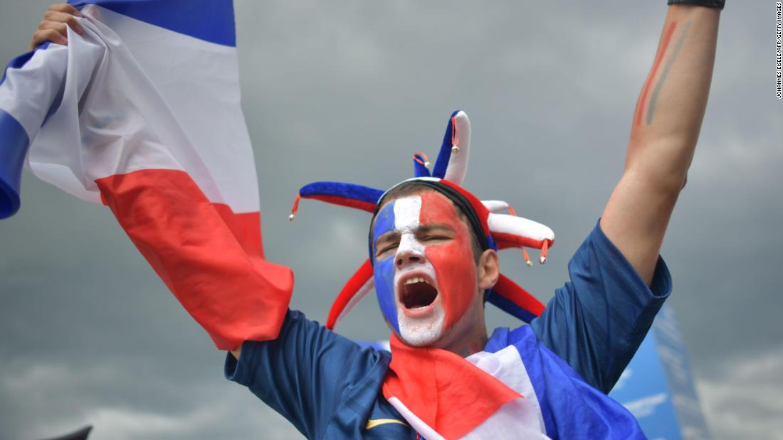 A France supporter cheers ahead of the match.