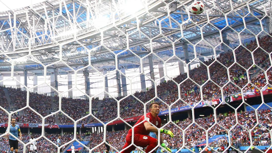Uruguayan goalkeeper Fernando Muslera watches the ball leak into the net after he misplayed an Antoine Griezmann shot in the second half.