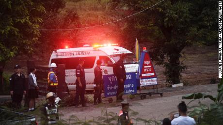 An ambulance leaves the Tham Luang cave area after divers evacuated some of the 12 boys and their coach trapped at the cave in Khun Nam Nang Non Forest Park in the Mae Sai district of Chiang Rai province on July 8, 2018. - Elite divers on July 8 began the extremely dangerous operation to extract 12 boys and their football coach who have been trapped in a flooded cave complex in northern Thailand for more than two weeks, as looming monsoon rains threatened the rescue effort. (Photo by LILLIAN SUWANRUMPHA / AFP) /         (Photo credit should read LILLIAN SUWANRUMPHA/AFP/Getty Images)