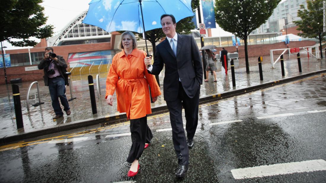 May joins then-Conservative Party leader &lt;a href=&quot;https://www.cnn.com/2012/12/13/world/europe/david-cameron---fast-facts/index.html&quot; target=&quot;_blank&quot;&gt;David Cameron&lt;/a&gt; during a party conference in Manchester, England, in October 2009. Cameron became Prime Minister the following year, and May was appointed home secretary.