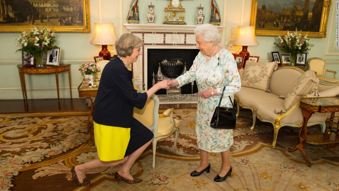 Queen Elizabeth II welcomes May at Buckingham Palace on the day she became Prime Minister.