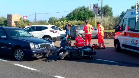 Ambulance personnel tend to a man lying on the ground, later identified as actor George Clooney, after being involved in a scooter accident near Olbia, on the Sardinia island, Italy, Tuesday, July 10, 2018. Actor George Clooney was taken to the hospital in Sardinia on Tuesday and released after being involved in an accident while riding his motor scooter, hospital officials said. &quot;He is recovering at his home and will be fine,&quot; spokesman Stan Rosenfield told The Associated Press in an email. The John Paul II hospital in Olbia confirmed Clooney had been treated and released after Tuesday&#39;s accident. Local media that had gathered at the hospital said Clooney left in a van through a side exit. (AP Photo/Mario Chironi)