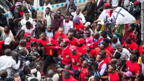Musician turned politician Robert Kyagulanyi (C) is joined by other activists at the protest in Kampala, Uganda on July 11, 2018. Sumy Sadurni/AFP/Getty Images.