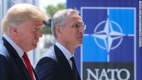 US President Donald Trump (L) walks with NATO Secretary General Jens Stoltenberg as he arrives to attend the NATO (North Atlantic Treaty Organization) summit, in Brussels, on July 11, 2018. (TATYANA ZENKOVICH/AFP/Getty Images)