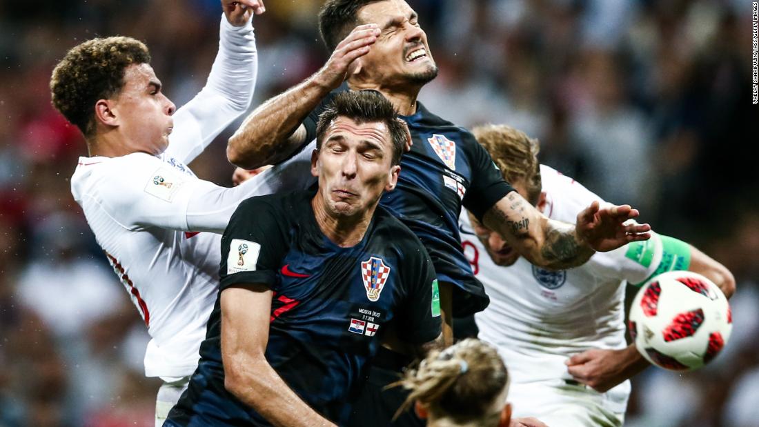 Players collide during the Croatia-England semifinal. Croatia played 120 minutes for the third straight match.