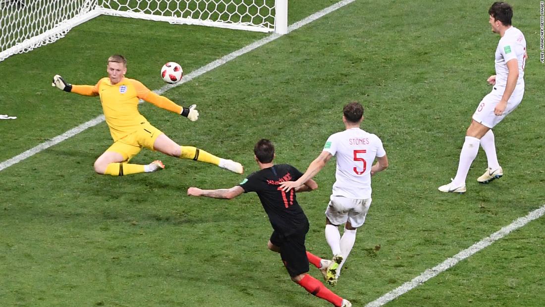 Mario Mandzukic scores against England late in extra time to give Croatia a 2-1 victory in the semifinals on Wednesday, July 11.