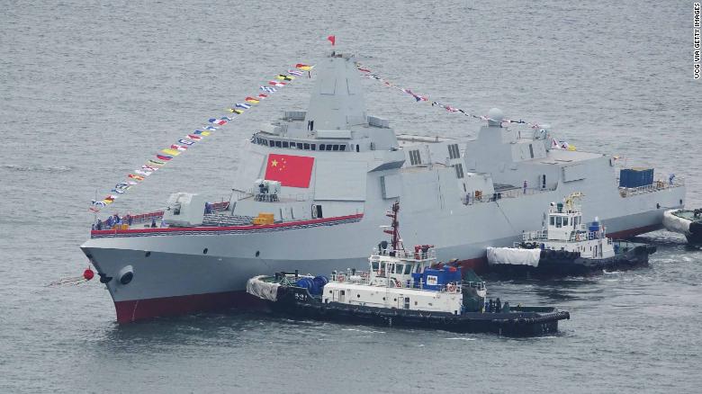 One of the two Type 055 guided-missile destroyers takes water at a shipyard in Dailan. 