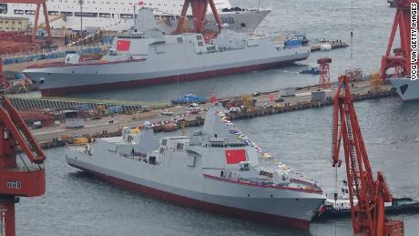 Two Type 055 guided-missile destroyers take water at a shipyard on July 3, 2018 in Dalian, Liaoning Province of China. Type 055 is the newest generation of guided-missile destroyer in China. (Photo by VCG)