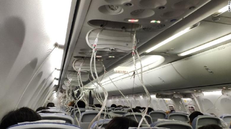 Passengers were required to wear oxygen masks after a loss of cabin pressure caused the plane to drop in the sky.