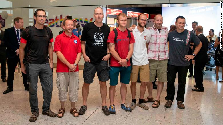 Divers and rescuers from the Thai cave mission arrive at Heathrow Airport Friday. From left to right: Chris Jewell Mike Clayton Rick Stanton Lance-corporal Connor Roe Josh Bratchley Gary Mitchell and Jim Warny 