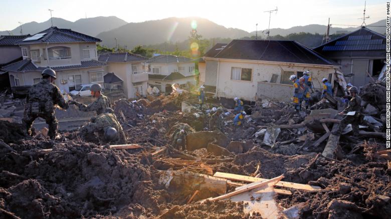 Japan Self-Defense Force members conduct search operations Wednesday in Kumano, Hiroshima.