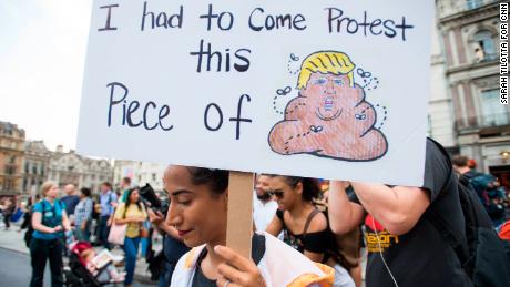 Mobashra Tazamal, from Washington, holds a placard in Trafagar Square.