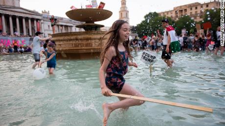 Aurora Haselfoot Flint celebrates her 10th birthday with a protest and splash in the Trafalgar Square fountain.