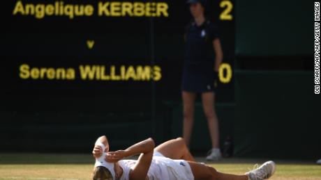 Kerber falls to the floor after her win
