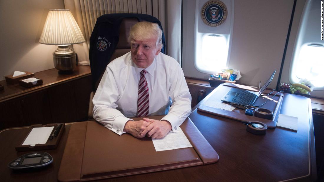 President Trump poses in his office aboard Air Force One at Andrews Air Force Base in Maryland after he returned from Philadelphia on January 26, 2017.