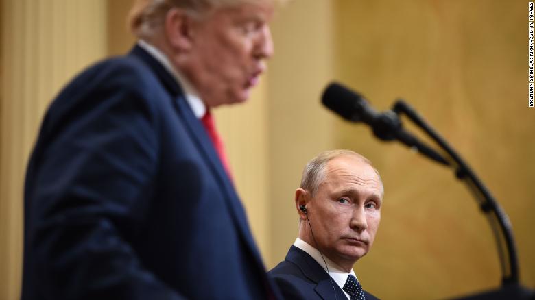 US President Donald Trump (L) and Russia&#39;s President Vladimir Putin attend a joint press conference after a meeting at the Presidential Palace in Helsinki, on July 16, 2018. - The US and Russian leaders opened an historic summit in Helsinki, with Donald Trump promising an &quot;extraordinary relationship&quot; and Vladimir Putin saying it was high time to thrash out disputes around the world. (Photo by Brendan SMIALOWSKI / AFP) (Photo credit should read BRENDAN SMIALOWSKI/AFP/Getty Images)