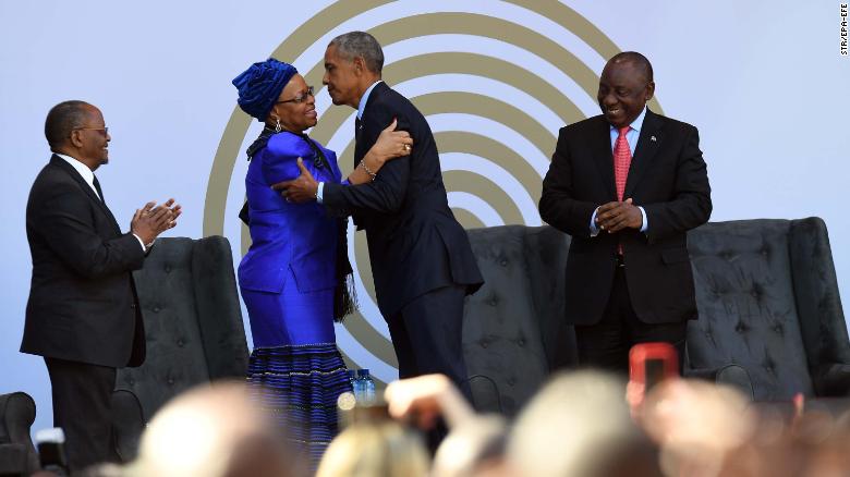 Nelaon Mandela&#39;s widow, Graça Machel, center left, greeting Barack Obama on Tuesday. 