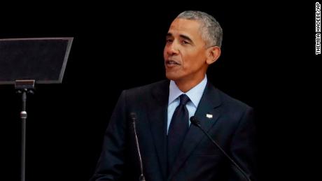 Former U.S. President Barack Obama, left, delivers his speech at the 16th Annual Nelson Mandela Lecture at the Wanderers Stadium in Johannesburg, South Africa, Tuesday, July 17, 2018. In his highest-profile speech since leaving office, Obama urged people around the world to respect human rights and other values under threat in an address marking the 100th anniversary of anti-apartheid leader Nelson Mandela&#39;s birth. (AP Photo/Themba Hadebe)