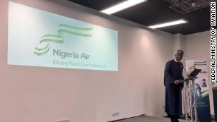 Nigerian Minister of State for Aviation, Hadi Sirika unveils the name and logo of Nigeria's new national airline at the Farnborough International Air Show in London on July 18, 2018. 