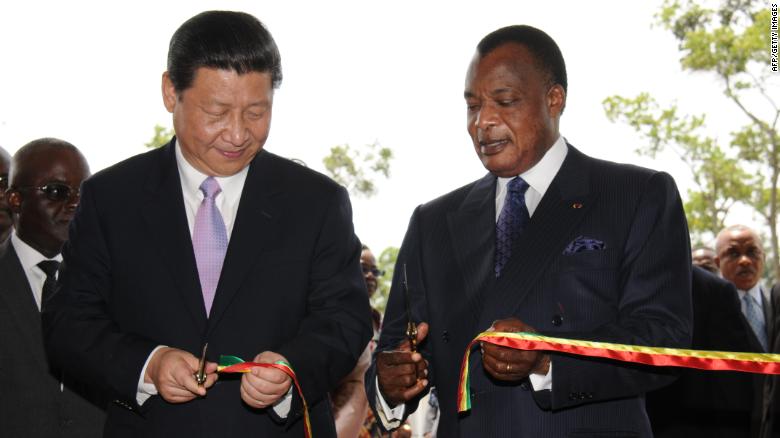 China&#39;s new President Xi Jinping (L) and Congo&#39;s Denis Sassou Nguesso President cut the ribbon on March 30, 2013, during Xi&#39;s first foreign trip.