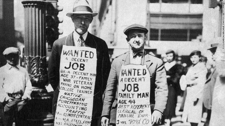 Two men wearing sandwich boards advertising their willingness to find employment - &#39;Wanted, a decent job&#39; - in Chicago during the Great Depression. Chicago, Illinois, USA, 15 April 1934. (Photo by FotosearchGetty Images).