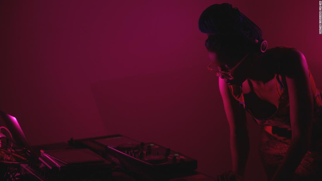 A pink-tinted Kampire DJing at Pussy Party.