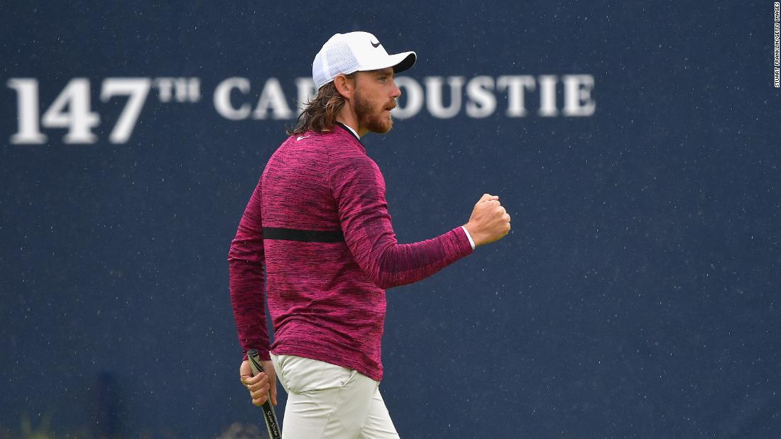 Tommy Fleetwood pumps his fist after a birdie on No. 18 on Friday. He finished with a 65.