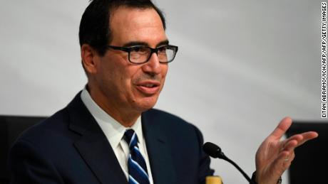 US Secretary of the Treasury Steven Mnuchin, gestures during a press conference in Buenos Aires, on July 22, 2018, at the end of the G20 Finance Ministers and Central Bank Governors meeting. - Group of 20 finance ministers warned on Sunday that &quot;heightened trade and geopolitical tensions&quot; posed risks to global economic growth as two days of meetings came to a close. (Photo by EITAN ABRAMOVICH / AFP)        