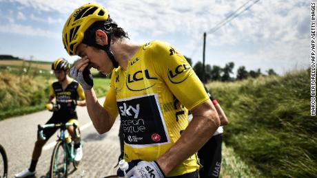 Great Britain&#39;s Geraint Thomas cleans his eyes after tear gas was used during a farmers&#39; protest who attempted to block the stage&#39;s route, during the 16th stage of the 105th edition of the Tour de France cycling race, between Carcassonne and Bagneres-de-Luchon, southwestern France, on July 24, 2018. - The race was halted for several minutes on July 24 after tear gas was used as protesting farmers attempted to block the route. (Photo by Marco BERTORELLO / AFP)        (Photo credit should read MARCO BERTORELLO/AFP/Getty Images)