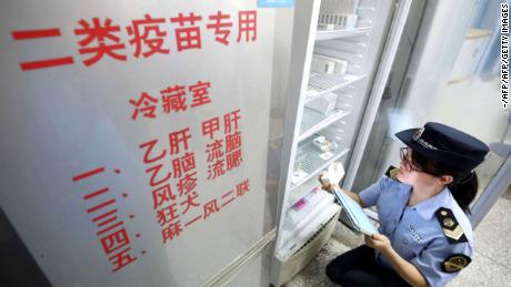 A local market supervisory authority official checks on vaccines at a hospital in Rongan in China&#39;s southern Guangxi region on July 23, 2018.