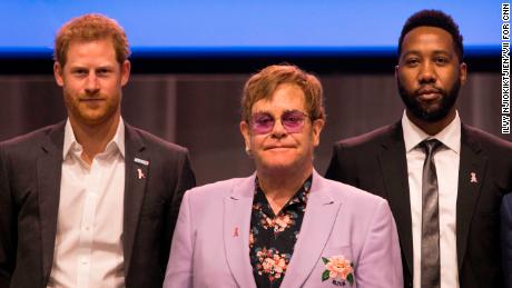 Sir Elton John (m), Harry, Duke of of Sussex (l) and Nelson Mandela&#39;s grandson Ndaba Mandela (r), on stage together during the International AIDS Conference in Amsterdam.